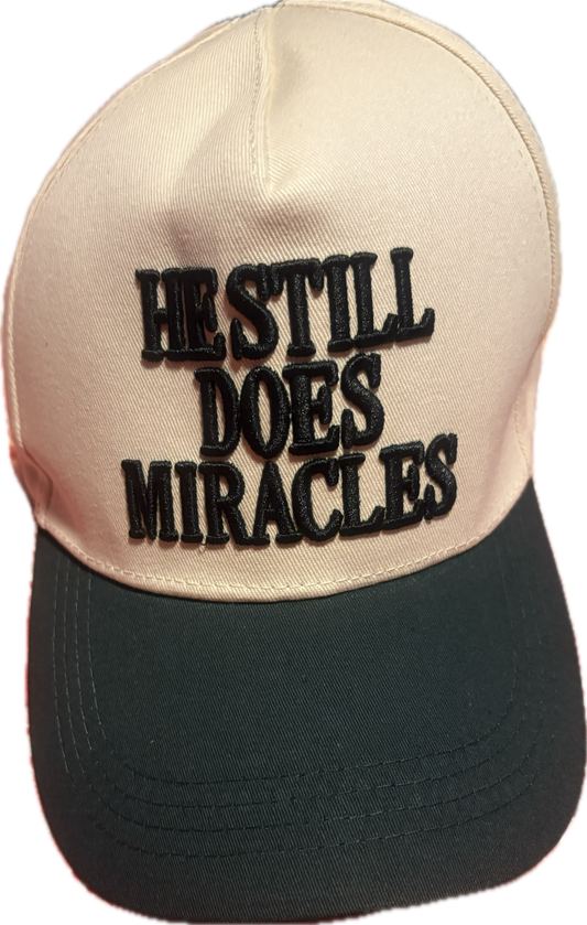 He Still Does Miracles Trucker Hat